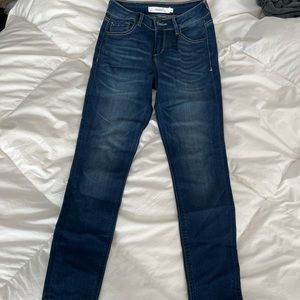 Hidden distressed hem skinny jeans